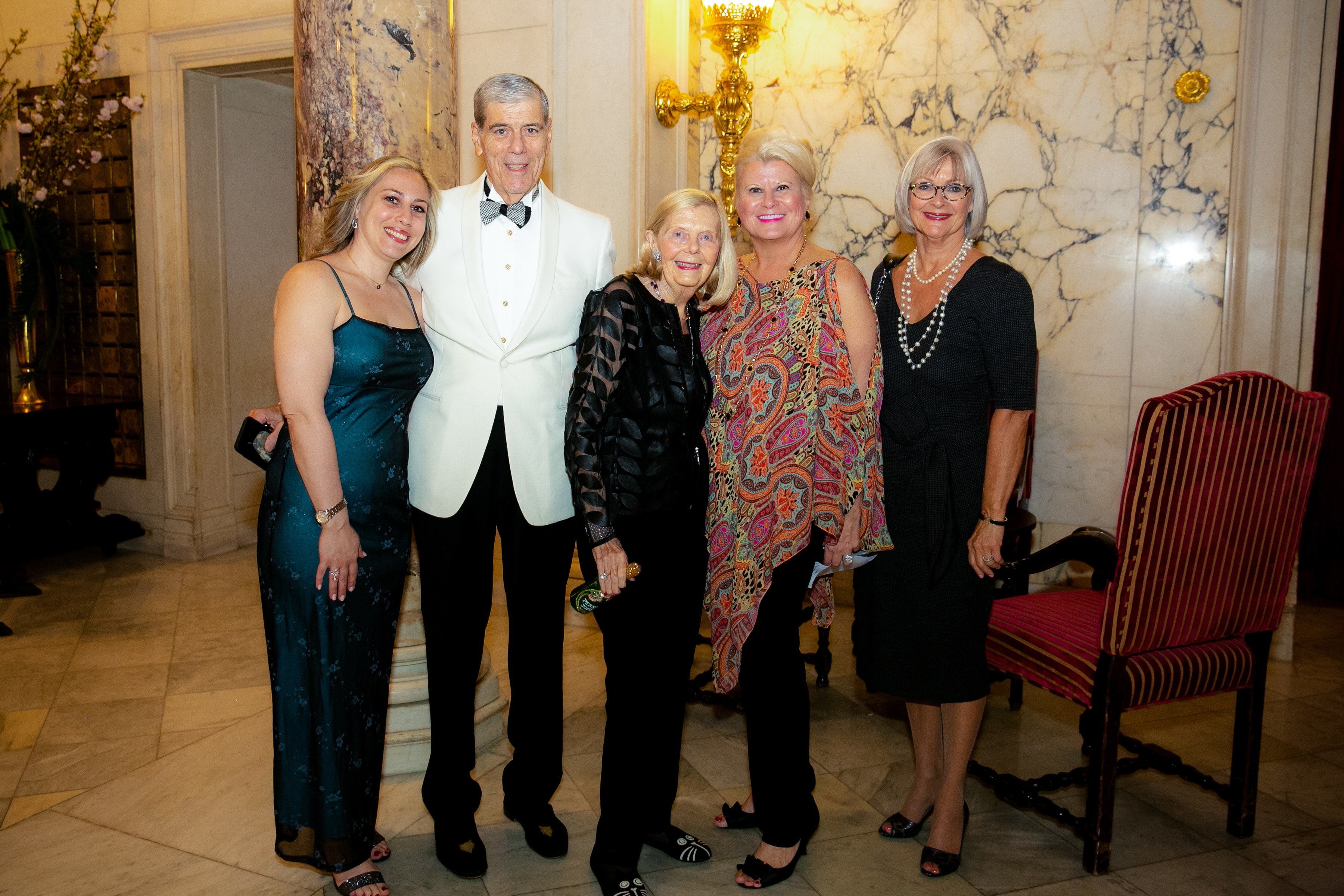 Five people pose together and face the camera at the 2019 Gala Event