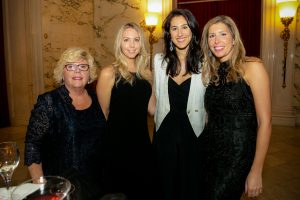 Four ladies stand and smile at the 2019 Gala