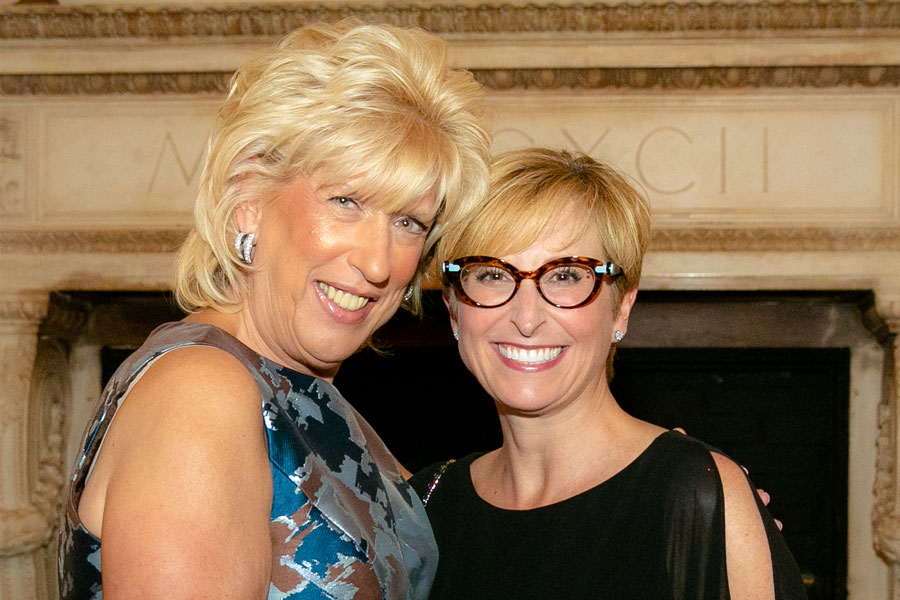 Two women standing side by side, smiling at the camera during the 2019 Gala