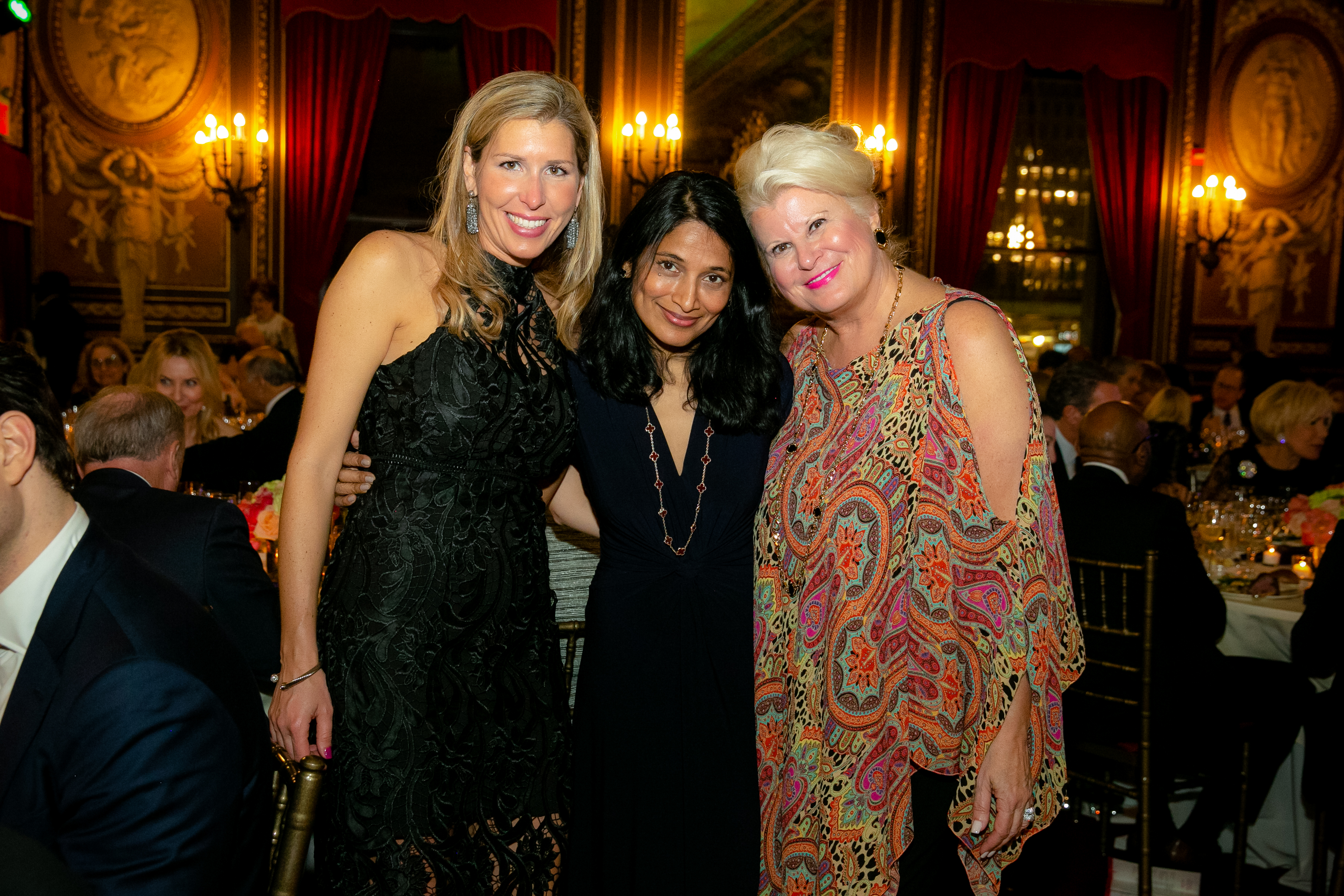 Three women stand and pose for a picture at the 2019 Gala Event