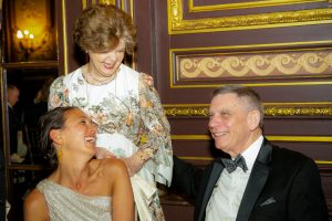 Dr. Legato standing and smiling with man and woman at gala