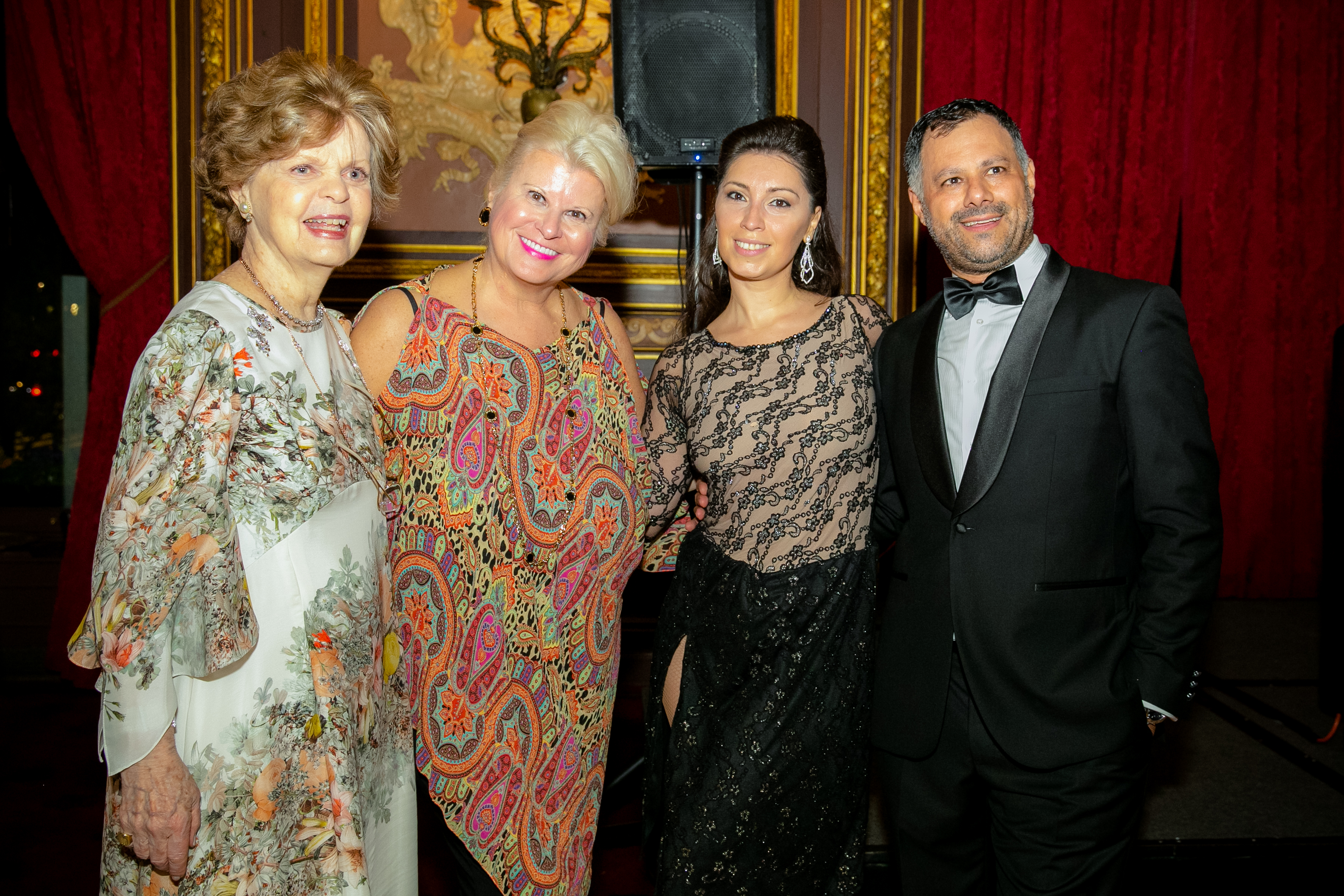 Dr. Legato pictured alongside smiling attendees at 2019 Gala Event
