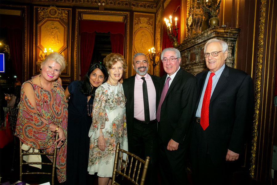 Dr. Legato standing with a group of five people at the 2019 Gala Event