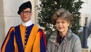 Dr. Legato smiling next to Pope’s Swiss Guard